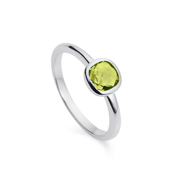 Silver solitaire ring with square peridot gemstone on a white background