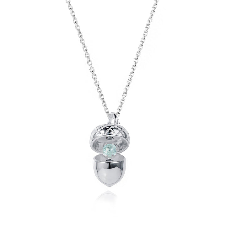 Sterling silver acorn pendant with a 4mm natural aquamarine March birthstone on white background