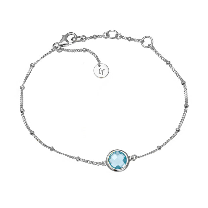 Sterling silver beaded chain bracelet with blue topaz