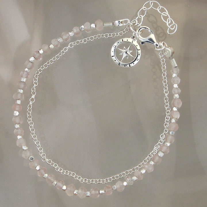 Sterling silver moonstone beaded bracelet and chain with a compass charm.