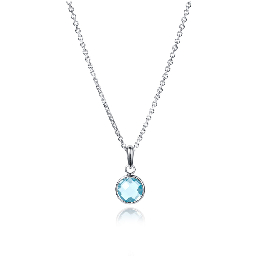 Dainty round silver pendant with a blue gemstone on a silver chain