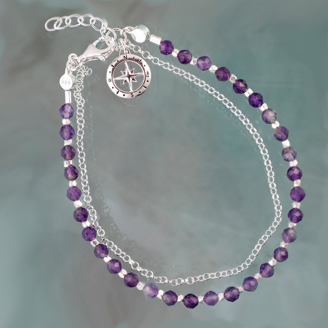 Sterling silver beaded compass bracelet in amethyst on a reflective background