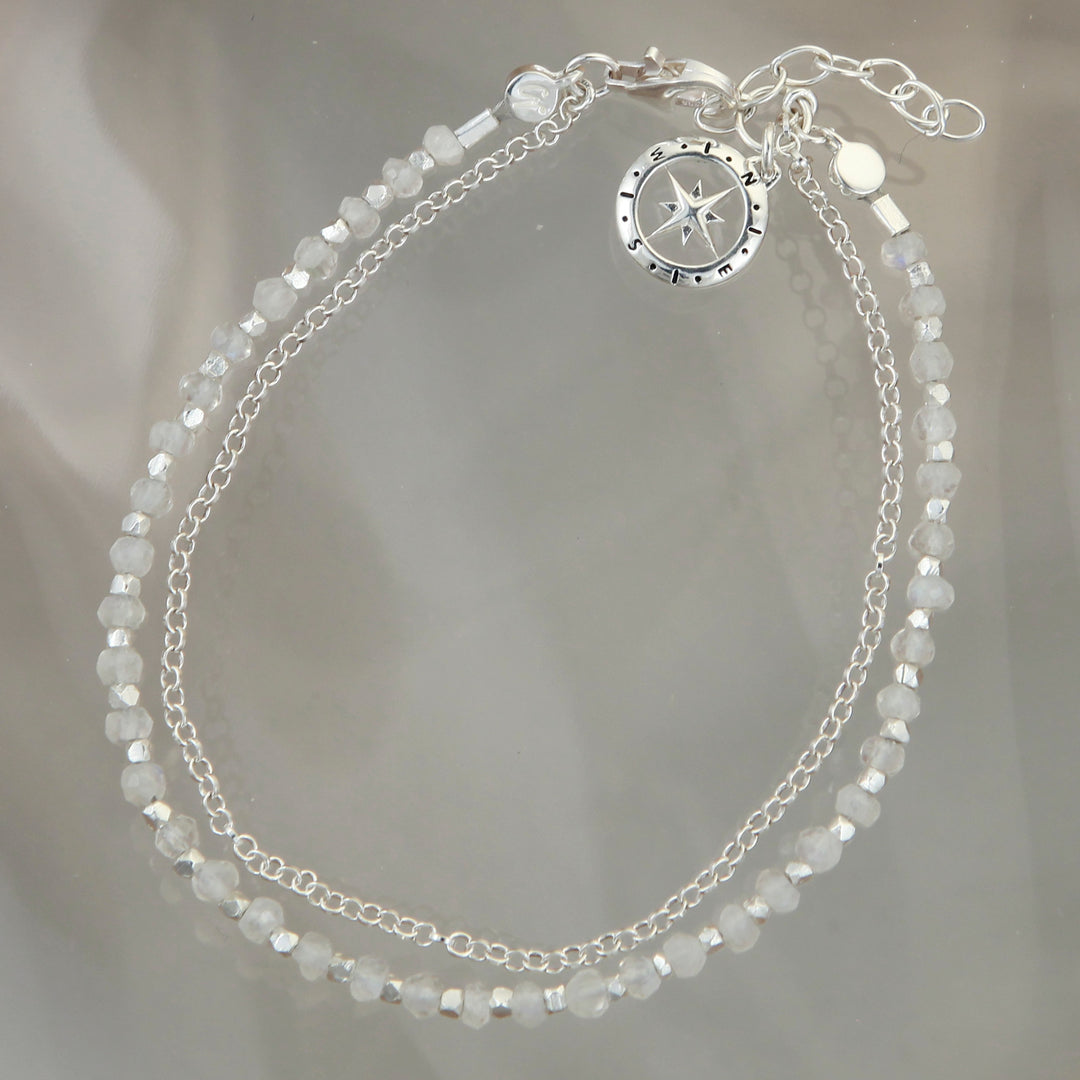Sterling silver beaded compass bracelet in moonstone on a reflective background