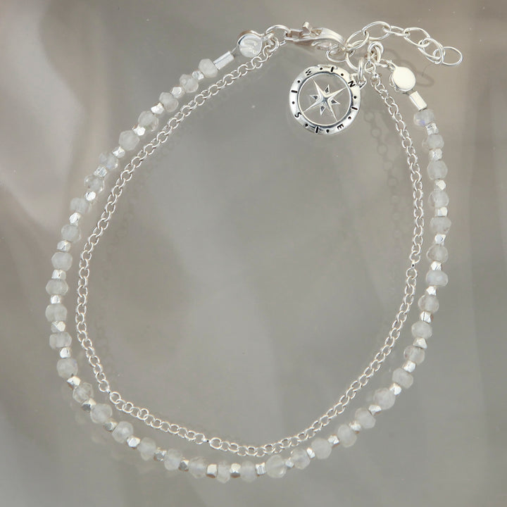 Sterling silver beaded compass bracelet in moonstone on a reflective background