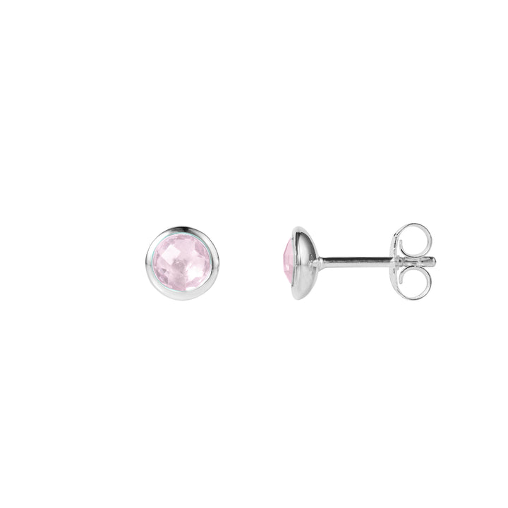 A pair of silver stud earrings with butterfly closures and pale pink rose quartz gemstones.