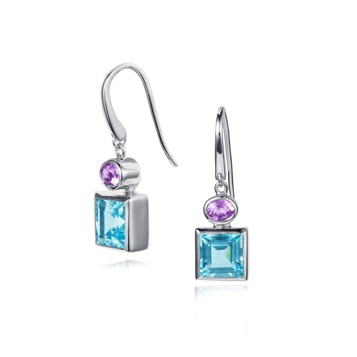 Pair of silver earrings with blue and purple gemstones on a white background