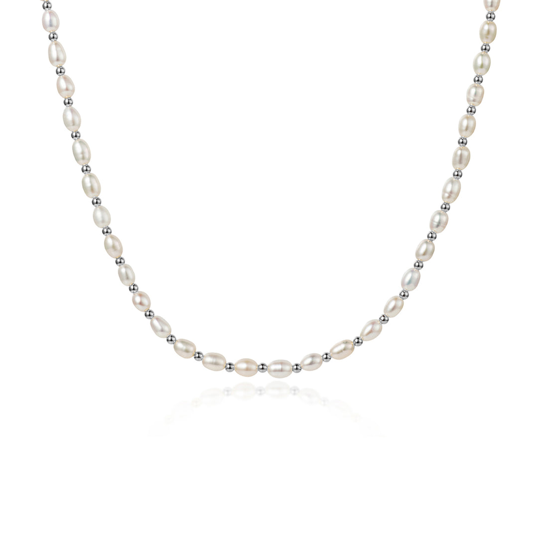Freshwater seed pearl necklace with silver beads on a white background