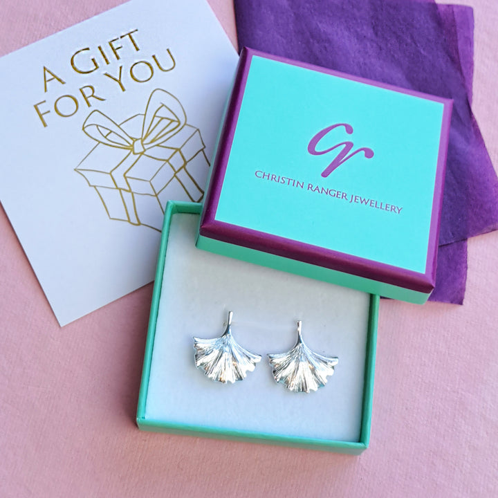 Sterling silver ginkgo leaf stud earrings in Christin Ranger gift packaging