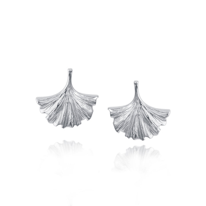 Pair of silver ginkgo leaf-shaped earrings on a white background