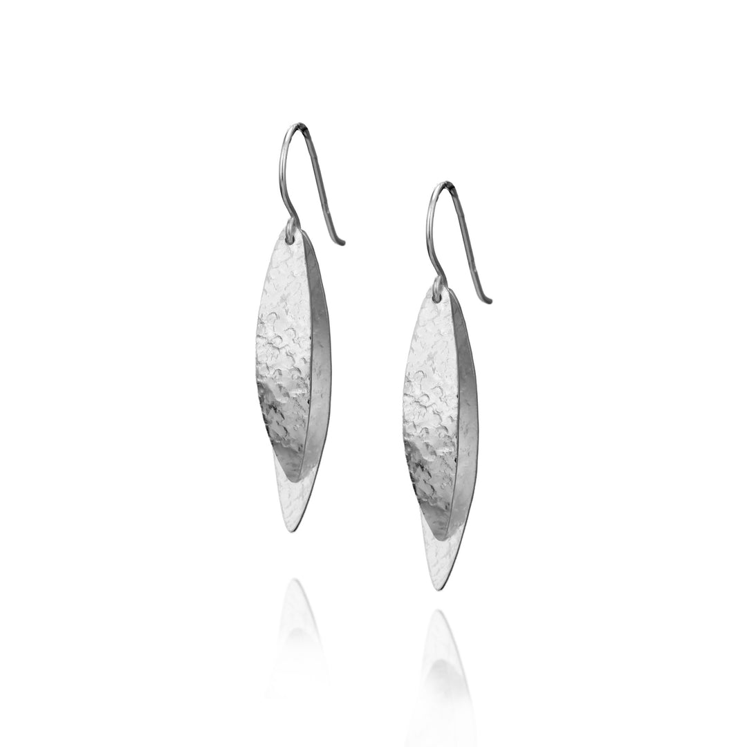 Pair of silver long drop earrings on a white background.