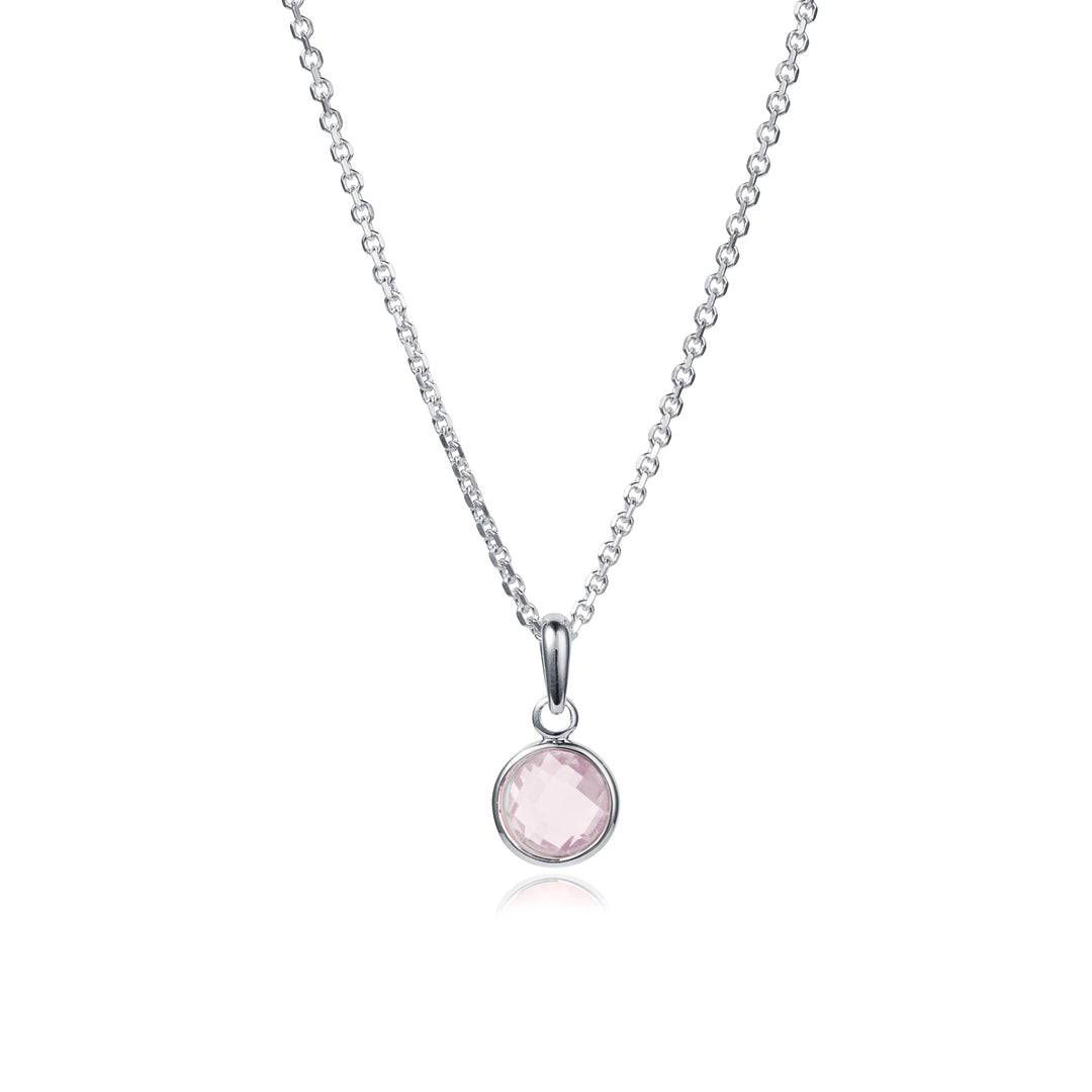 Dainty sterling silver necklace with a pale pink gemstone pendant on a white background
