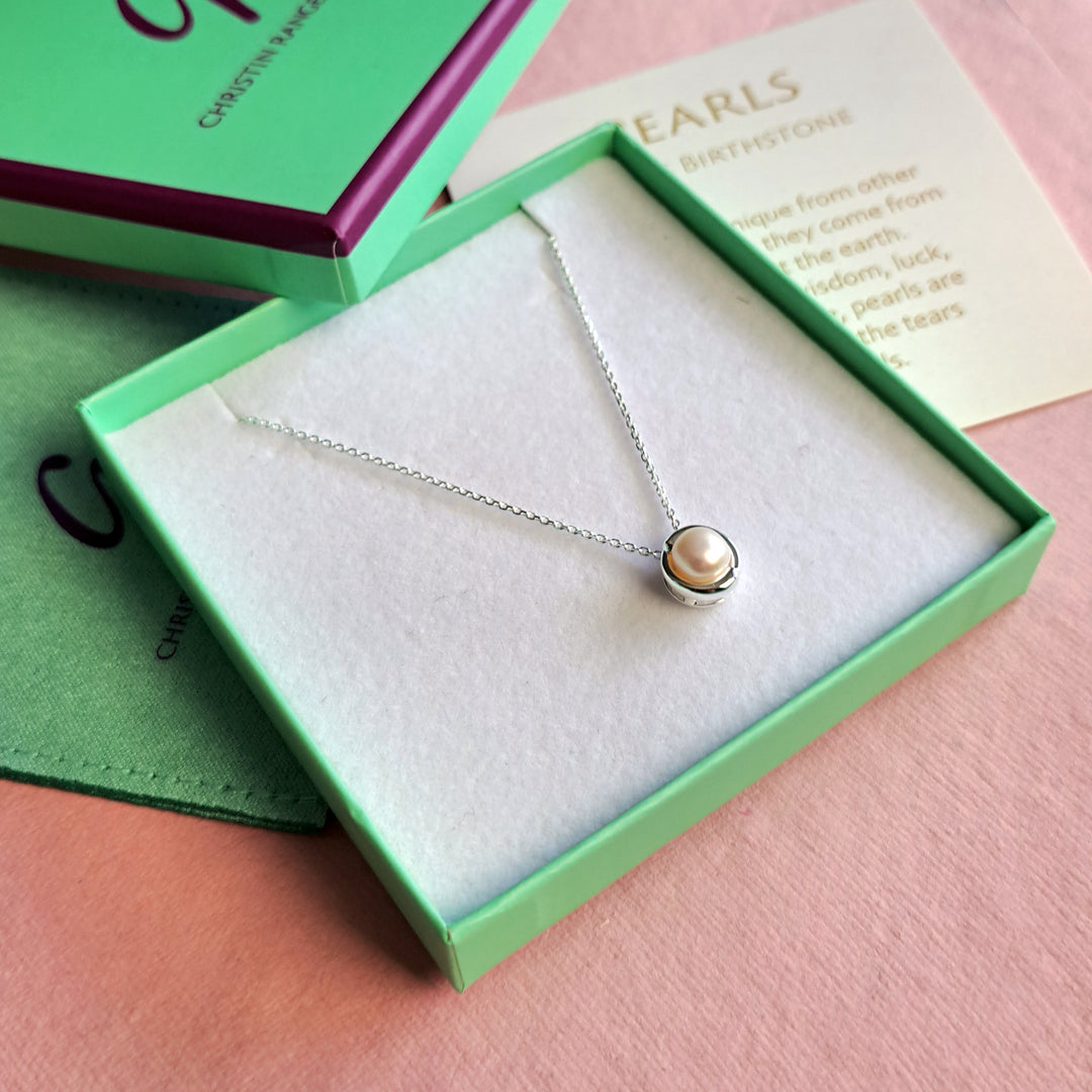 Close up of Sterling silver pearl pendant necklace in a gift box