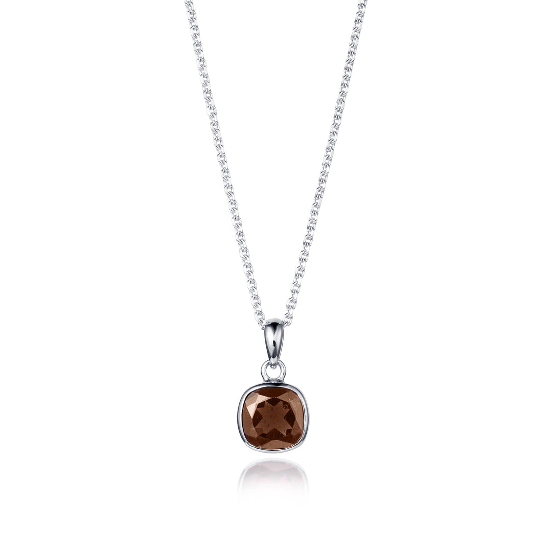 Silver necklace with a brown quartz pendant on a white background