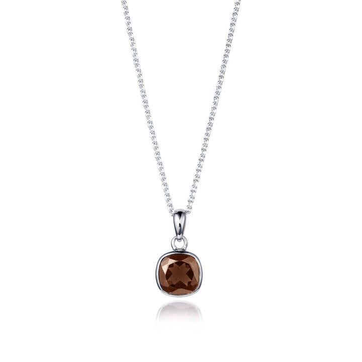Silver necklace with a brown quartz pendant on a white background