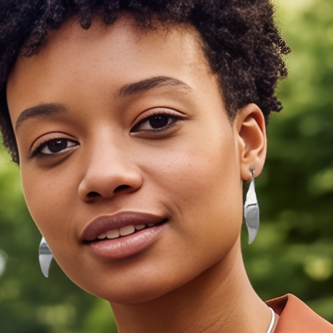 Woman wearing sterling silver long drop threader earrings