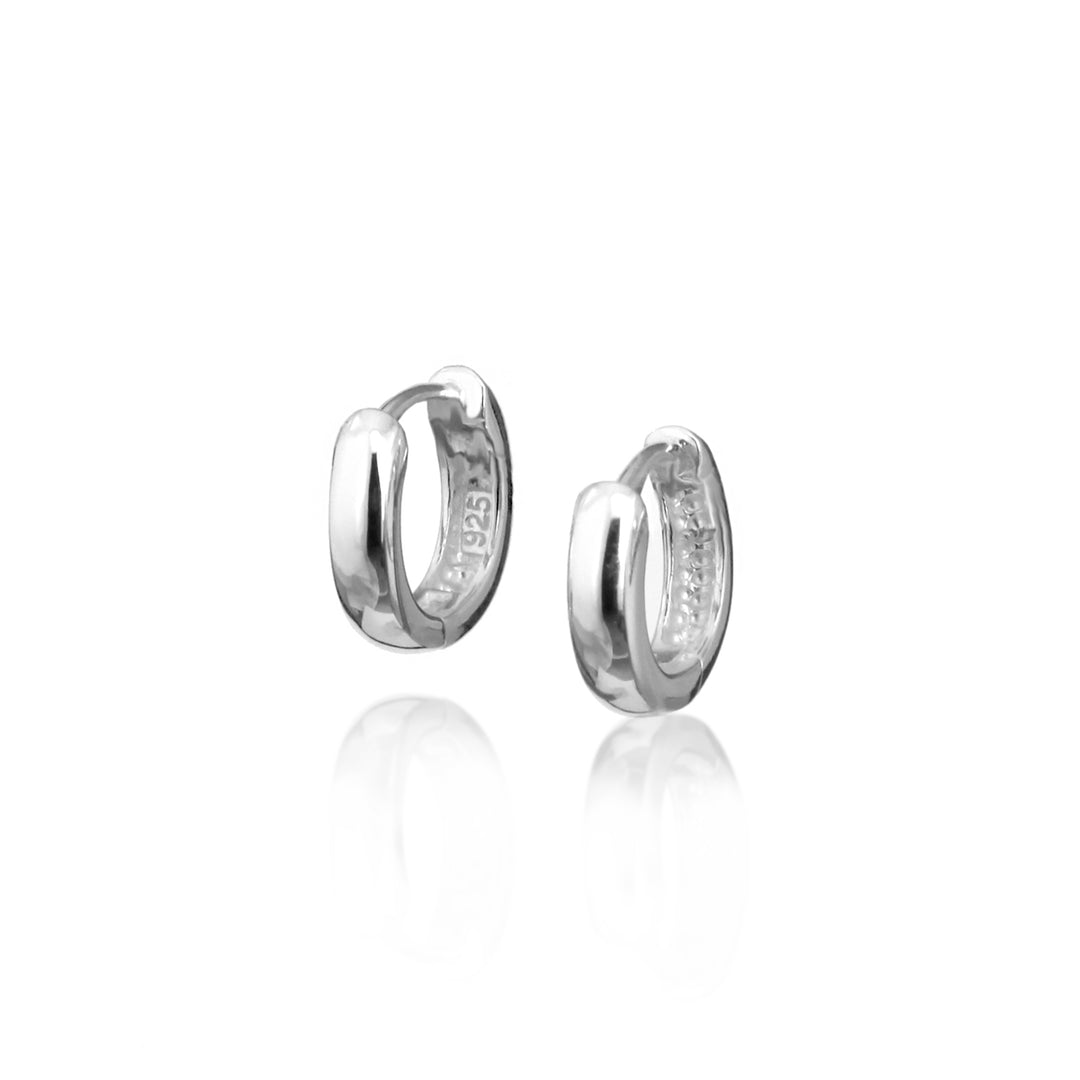 Pair of silver hoop earrings on a white background