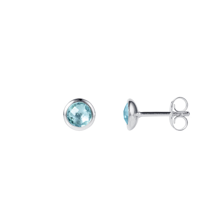 Pair of silver stud earrings with blue gemstones on a white background