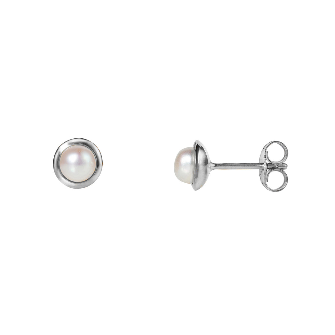 Small round pearl stud earrings in silver on a white background