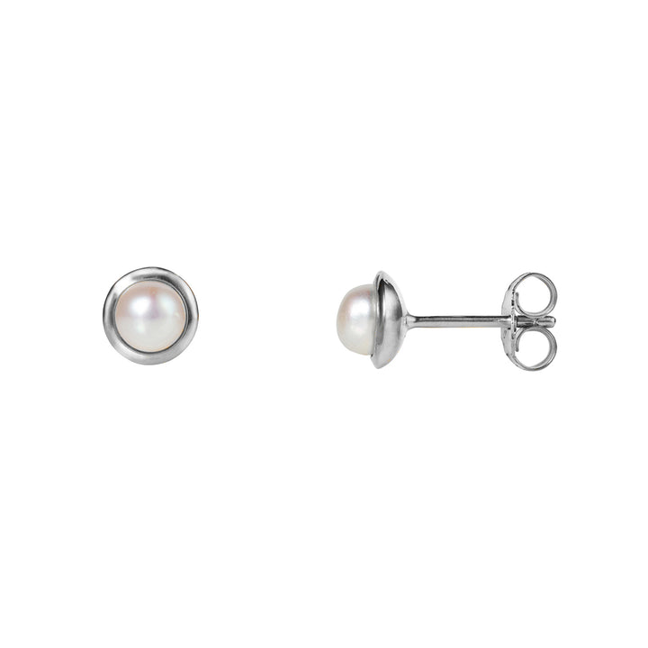 Small round pearl stud earrings in silver on a white background