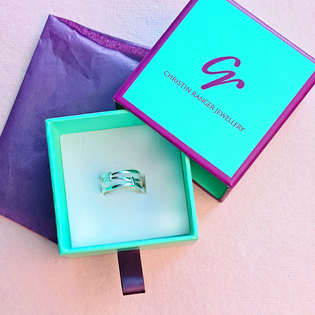 Sterling silver knotted ring in gift packaging