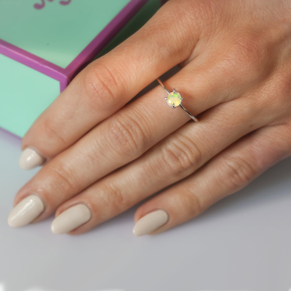 Close-up of woman wearing an opal ring in sterling silver