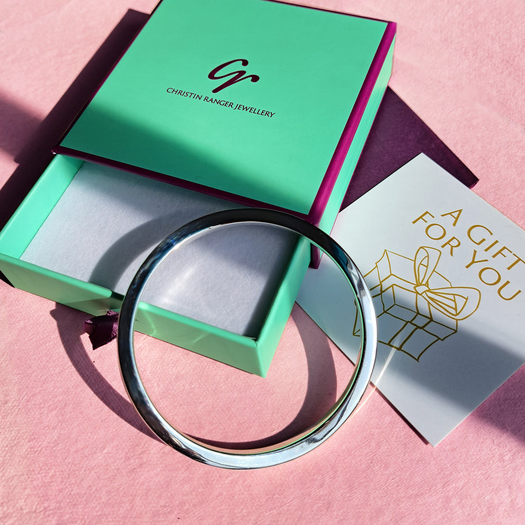 Sterling silver wave bangle in a Christin Ranger gift box with card