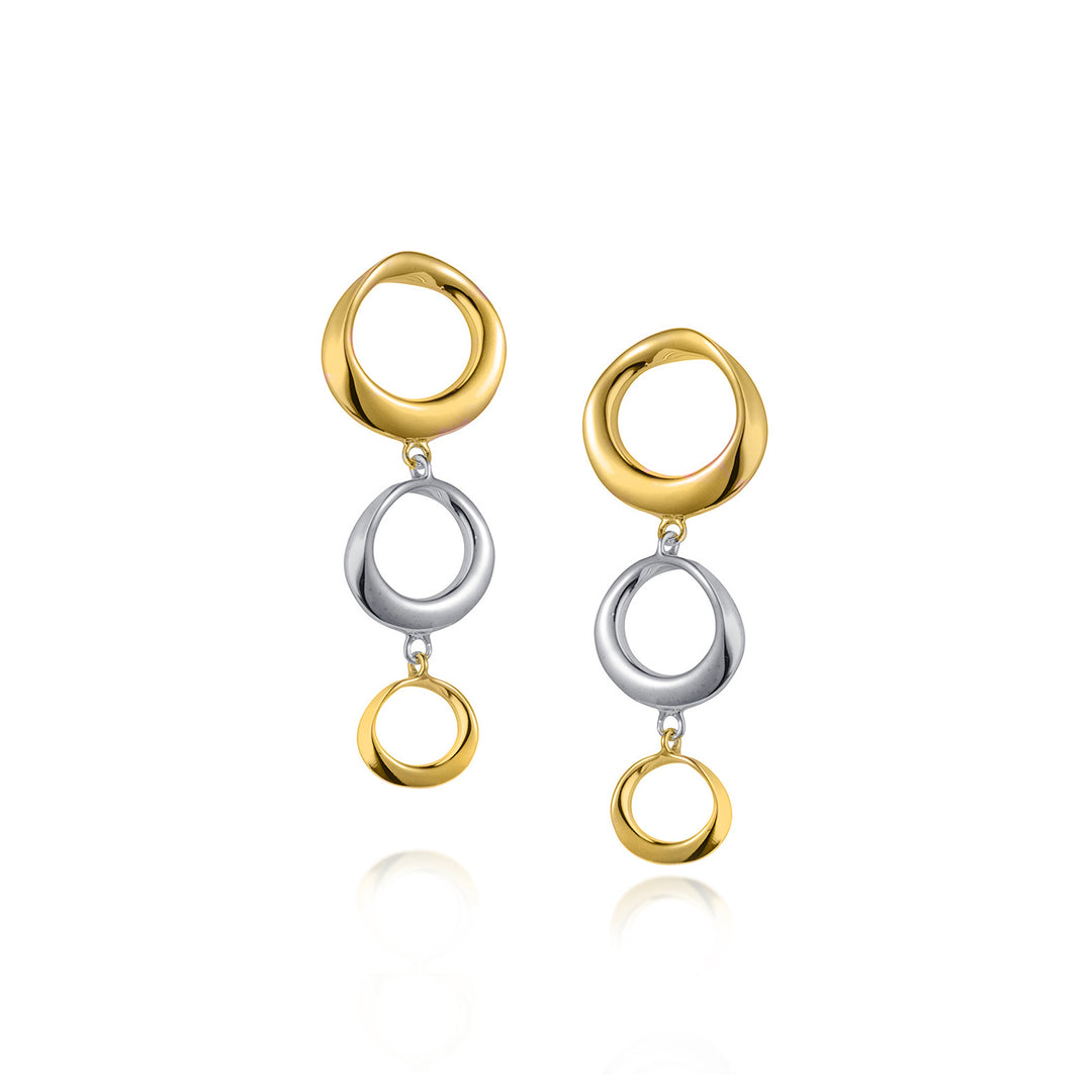 Pair of delicate gold and silver three ring earrings on a white background
