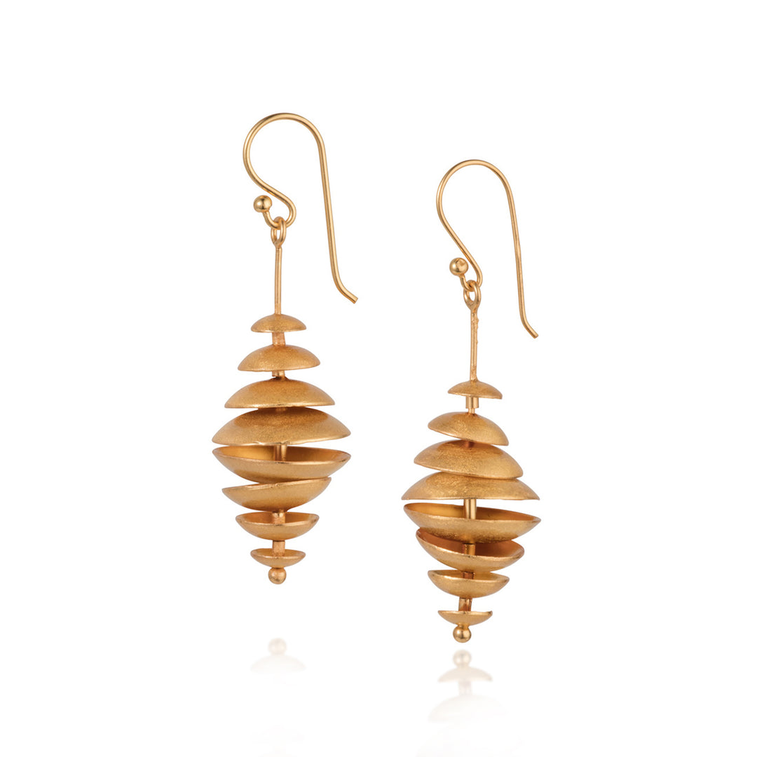 Gold multi-disk drop earrings on a white background