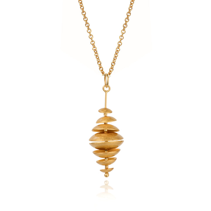 Unique multi disk gold necklace on a white background