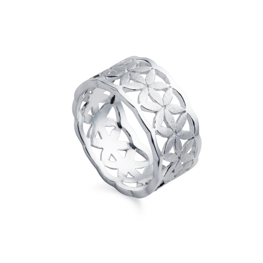 Wide silver band with floral design and matte finish on a white background