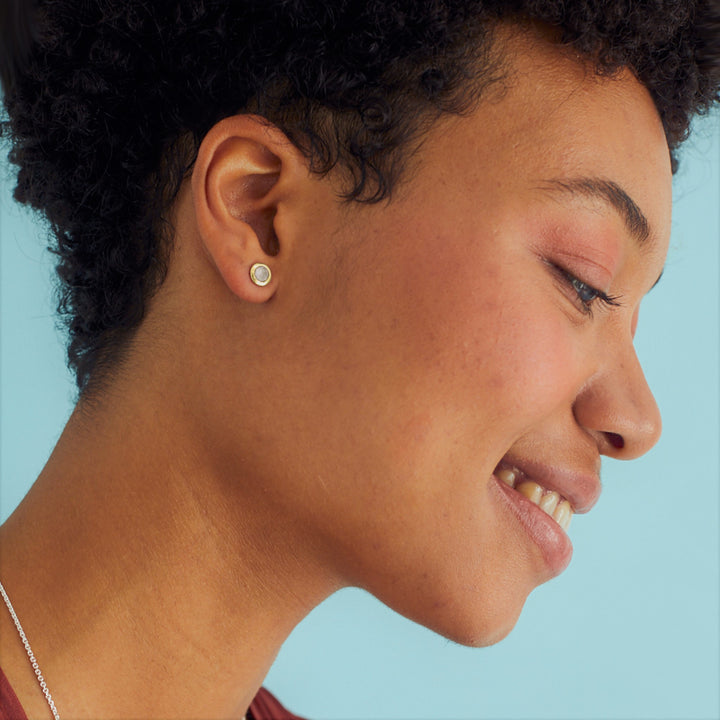 Model Wearing Gold and Moonstone Stud Earrings