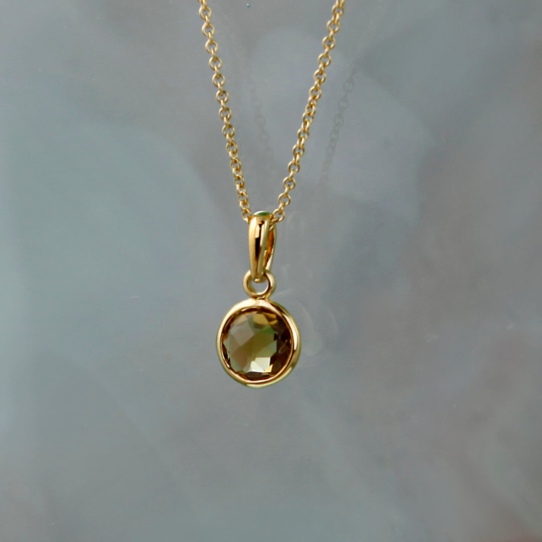 Staged Shot of Gold and Cognac Quartz Maya Pendant