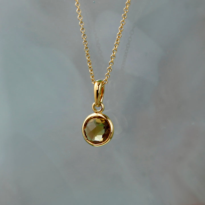 Staged Shot of Gold and Cognac Quartz Maya Pendant