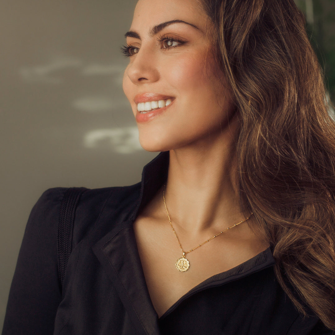 Model Wearing Gold Zodiac Pendant Necklace