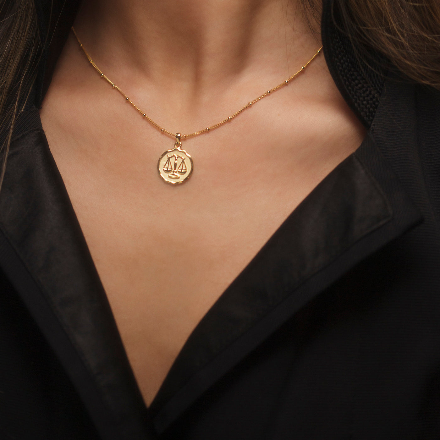 Model Wearing Gold Zodiac Pendant Necklace
