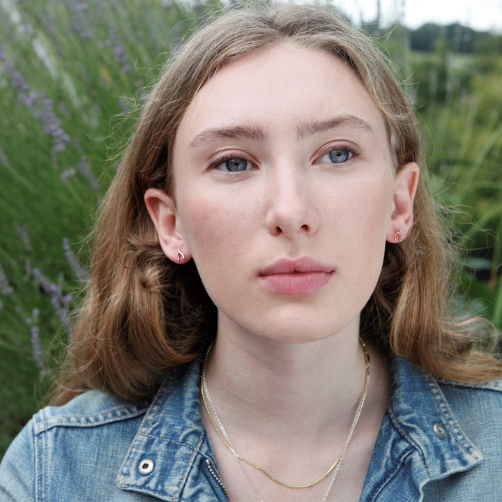 Model Wearing Rose Gold Wishbone Stud Earrings