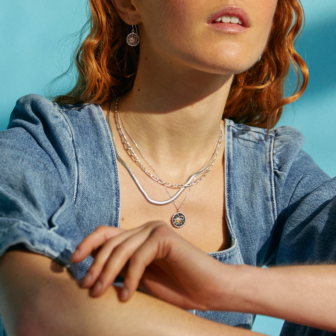 Model Wearing Heaven-Sent Sun & Moon Pendant in Matte Silver