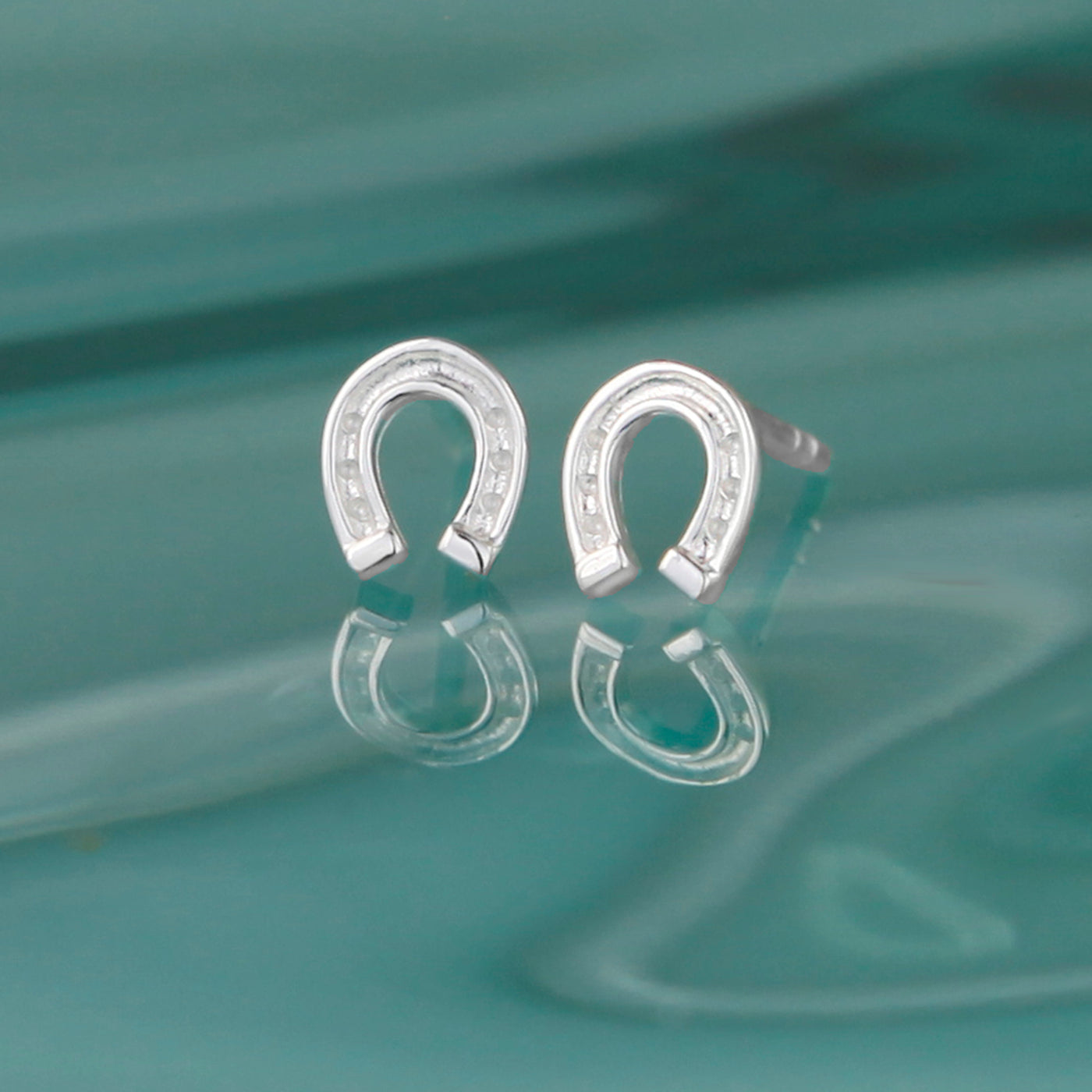Photo of Mini Silver Horseshoe Stud Earrings