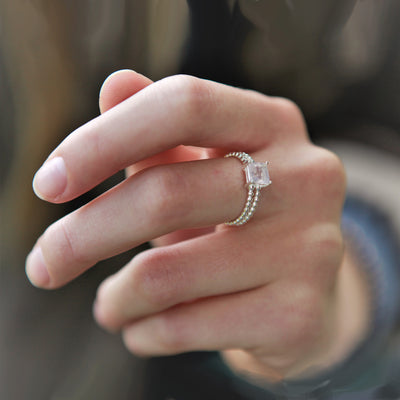 Model Wearing Silver Ring With White Topaz