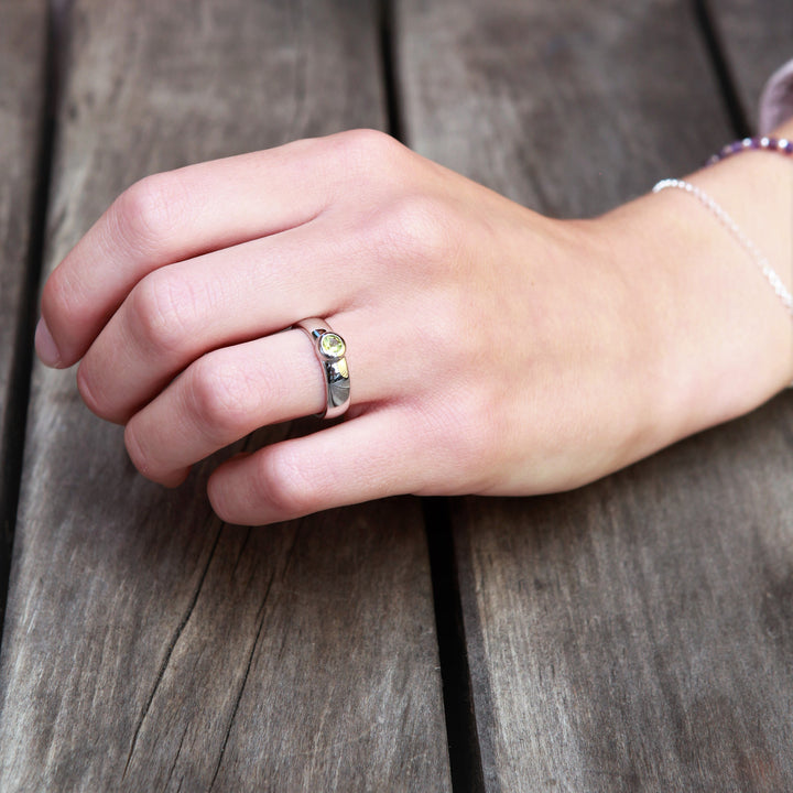 Model Wearing Silver Solitaire Ring With Peridot Stone