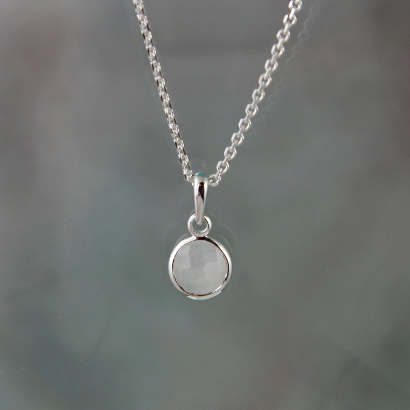 Staged Shot of Silver and Moonstone Maya Pendant