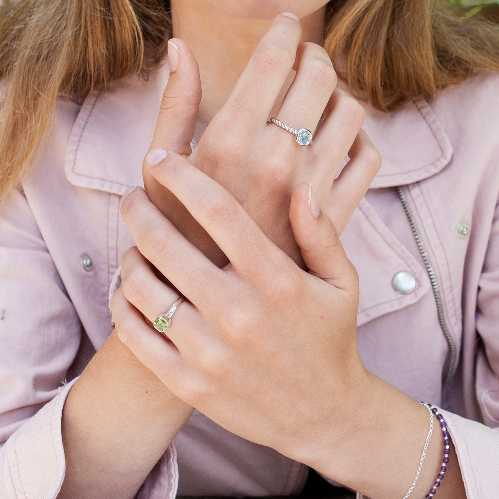 Model wearing Blue Topaz Silver Ring