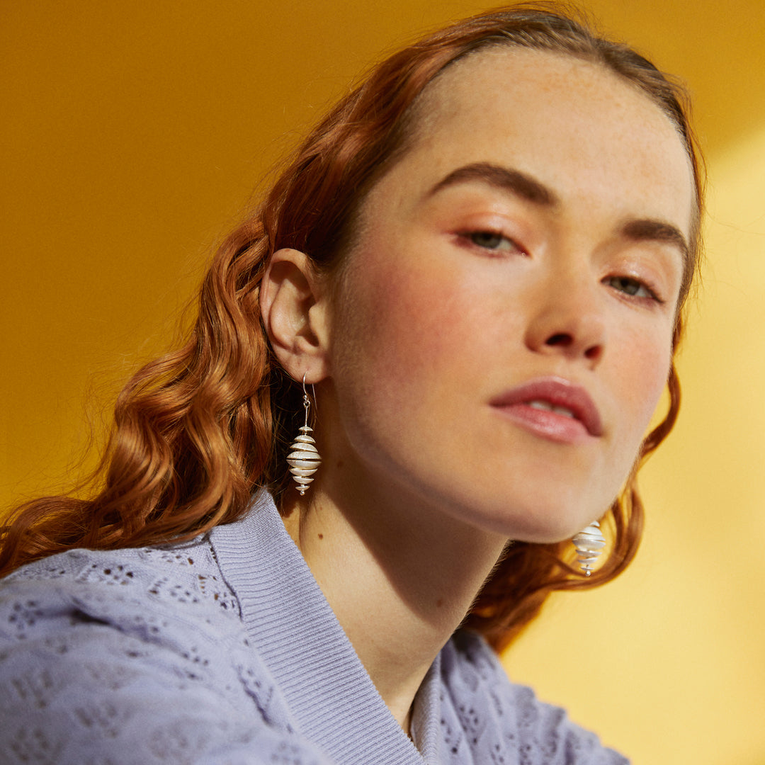 Model Wearing Topsy Turvy Silver Earrings