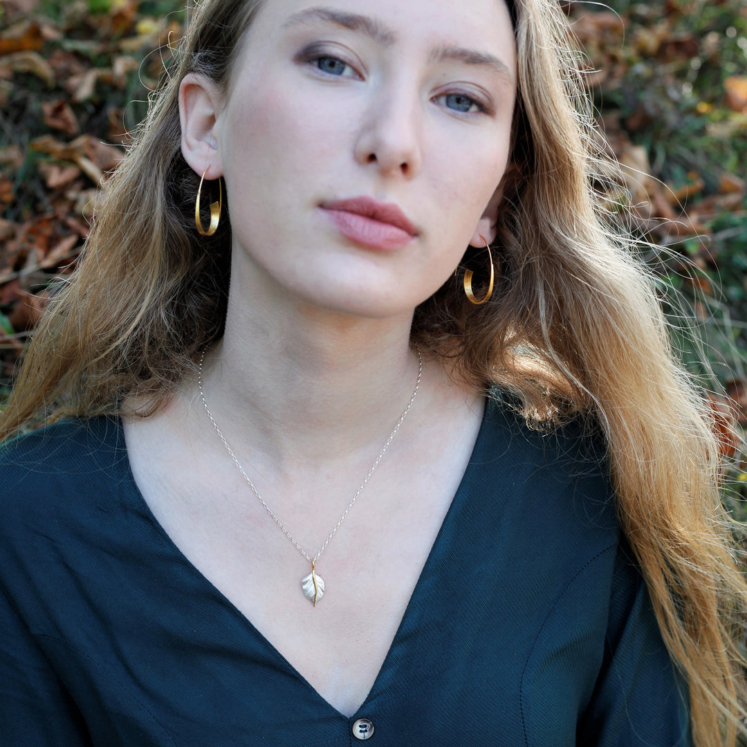 Model Wearing Golden Leaf Silver Pendant