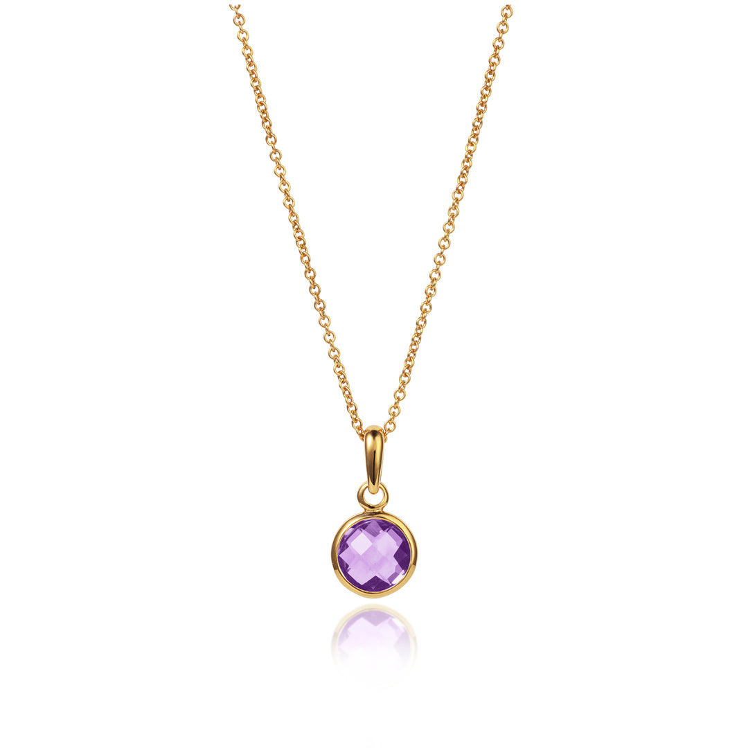 image of a dainty round amethyst gemstone set in gold with chain on a white background.