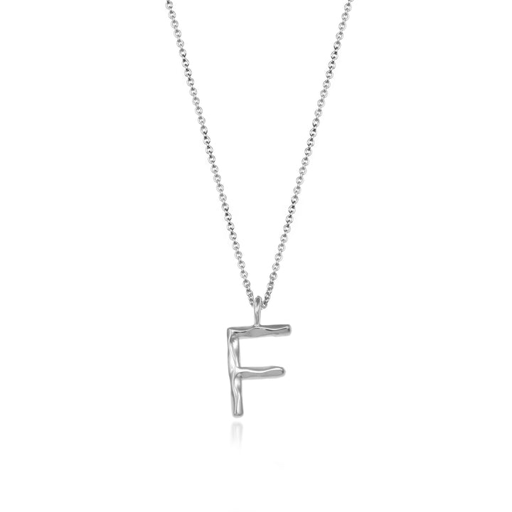 Sterling silver letter F initial necklace pendant with chain on a white background.