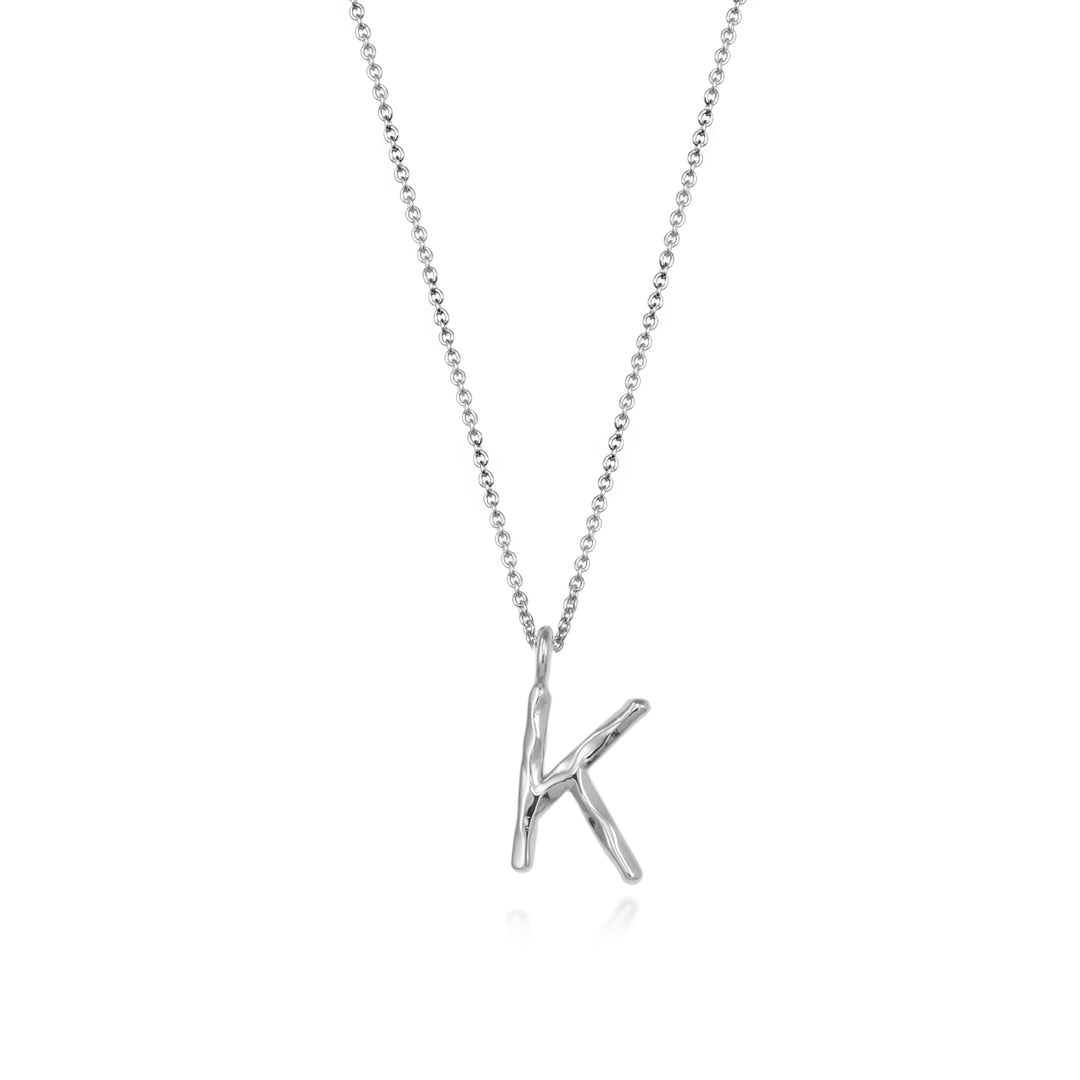 Sterling silver letter K initial necklace pendant with chain on a white background.