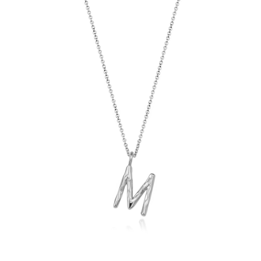 Sterling silver letter M initial necklace pendant with chain on a white background.