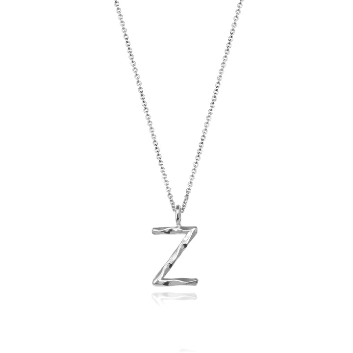 Sterling silver letter Z initial necklace pendant with chain on a white background.