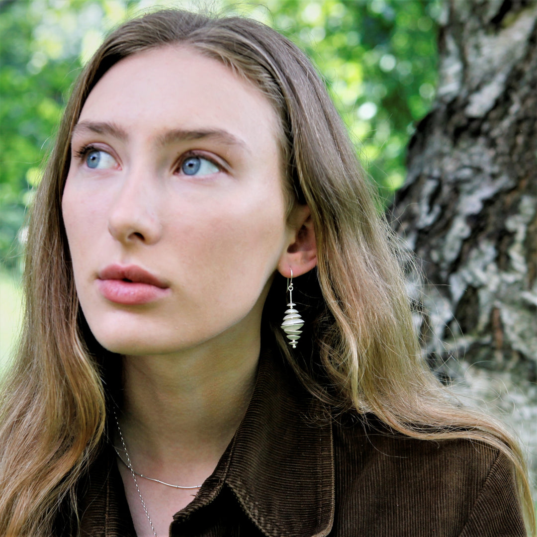 Model Wearing Topsy Turvy Silver Earrings